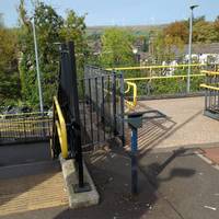 Exit the Yorkshire-bound platform via the stairs or ramp, heading left towards the bus turning cycle.