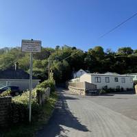 Turn right into Ffordd Pen Llech by the sign noting it is 'the world's steepest street'.