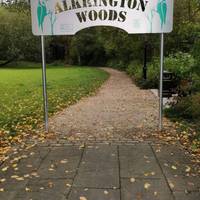 Enter Alkrington Woods via the gateway opposite the bus station. Follow the loose-stone path past the bench and noticeboard.