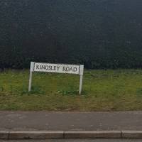 As the road bends at a junction, keep ahead to enter Kingley Road.