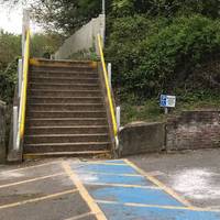 Walk up yellow set of stairs opposite Pilgrim Cycles and turn left over the bridge.