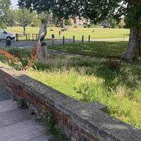 The river crane crosses the road here. Enter the park on the right.
