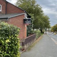 Look out for Parbrook Court on the left and the footpath just after it.