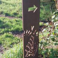 Keep going along the path, in the summer you might spot butterflies floating around in the grassland up to your left.