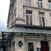 Behind you is Charles II St. Walk along this road, heading away from the theatre.