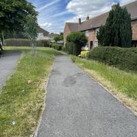 Facing the road, head right down a tarmac path slightly downhill away from the main pavement.