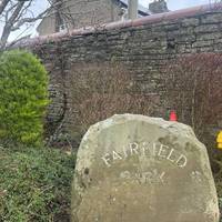 This Fairfield Park stone, marks the start point of this walk. Turn left past the stone and continue behind the brick wall.