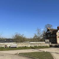 You'll soon approach a small triangular green with a bench. Turn right here onto The Street. Dogs should be on leads throughout this walk.