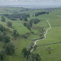 You’ll cross over some fields and a stone stile. There’s a left fork to take you to Gorsdale Scar, but continue ahead to the cove