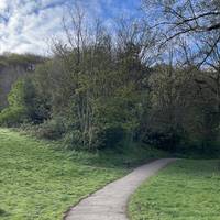 You can either go left at the fork (as pictured) or right over the bridge next to the playground. The paths converge after a few metres.
