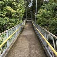 Exit the station via the stairs or ramped walkway.