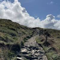 The path is very uneven and rocky for much of the walk and likely slippery in wet weather. So take care with your footing.