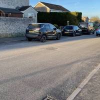 Pass a couple of houses and then look for a finger post on the opposite side of the road by a large hedge.