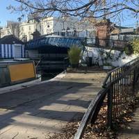 Around the corner is the Westbourne Terrace Bridge. Take the ramp up. The tow path switches to the left bank for the rest of the route.