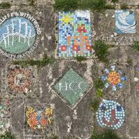 Can you find the colourful mosaics on the ground celebrating the opening of the park?