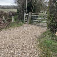 Look for this driveway with the two concrete bollards that is the public footpath walk down there and up the hill.