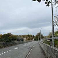 Exit the station and turn right to cross over Wylam Bridge.