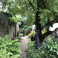 Walking across the patio towards the house, you’ll find a sculpture of Sir Gibberd himself who created and planned the garden.