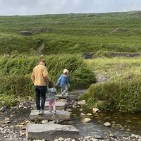 Looking at the beach, head right across some large stepping stones.