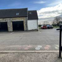 Bear slight right to walk through the car park. Notice the footprints which help guide you.