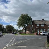 With your back to the library, turn right. Cross over the side road, Wealcroft, and then pause to cross Cotemede.