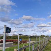 Walk past the gate and continue straight ahead along the Bridleway way with Rushcliffe Oaks Crematorium on your left.