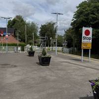 Head towards the level crossing to exit the platform.
