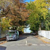 Turn right onto St Agnes Avenue. On your left Saint Saviour's House. On your right The Gothic Mansion.  City in background. Head down hill.