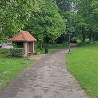 Walk past the hut with a bench