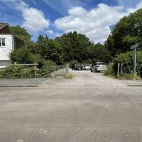 Look out for the entrance to Lawrence Weston Community Farm and cross using the drop kerbs towards it. Head onto the path.