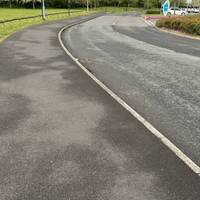 Turn right and head along the quiet road