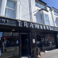 Start at Trawlers, a well-rated Fish’n’Chip shop. Choose from an array of delights. Take away to eat on the beach. Or dine in too.