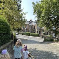 At the end of the road, follow the bend in the road to turn left into Dean Park Crescent and head uphill.