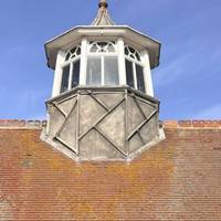Notice the attractive lantern above the booking hall and the platform to the rear of the station.