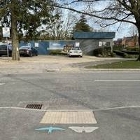 Look out for the blue swift symbol on the pavement by the drop kerb and cross the road.