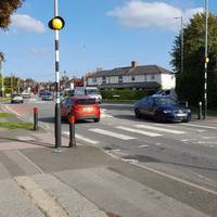 The path emerges onto Whitworth Road.  Turn left and use the zebra crossing to get onto Pinehurst Road.