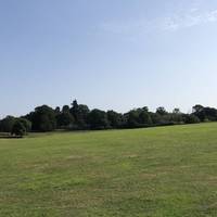 Walk across the field after getting past the overflow car park