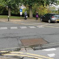 Cross the road carefully via the tactile paving and head for the entrance to Peel Park to the right marked by a green sign.