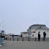 Facing the art deco pier and Pavillion Theatre, follow the ramp up the broadwalk towards the left hand side and up onto the pier.