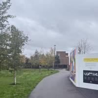 Walk along the path on the right hand edge of the path, with the boards on the right.