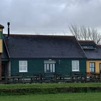 Fremington Quay Heritage Centre and excellent cafe will be across the green to your left.