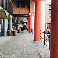 The buildings surrounding the docks were warehouses which once stored cargos such as brandy, cotton, tea, silk, tobacco, ivory & sugar.