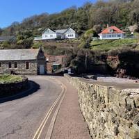 Turn left down the hill towards the old lifeboat house. You're now on the South West Coast Path.