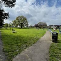 Turn right onto a narrower tarmac path that cuts across the park. The park was created to remember local people killed during WWII.