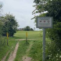 Follow the yellow posts to the Golf Clubhouse WATCH OUT FOR FLYING GOLF BALLS first tee to the right