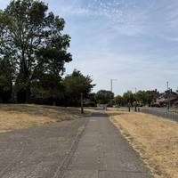 Continue for a few metres with Kingfisher park on your left and the road on your right. Get ready to turn left into the park.