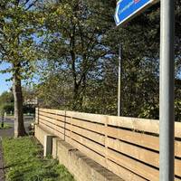 After crossing, turn left and follow the signs to the station.