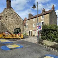 Follow the road around to the left and then cross over into the pedestrian Sheppard's Barton.