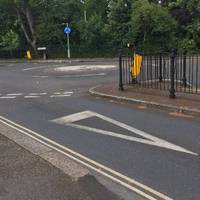 At the mini-roundabout with Red Post Hill cross over to go right on Red Post Hill. 