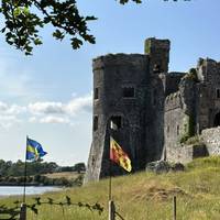 Carew Castle has a rich history which spans over 2,000 years. Continue along the tarmac on Castle Lane with the castle on your right.